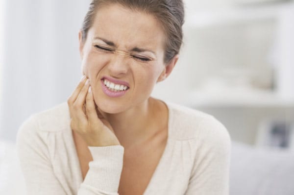 Woman with jaw pain